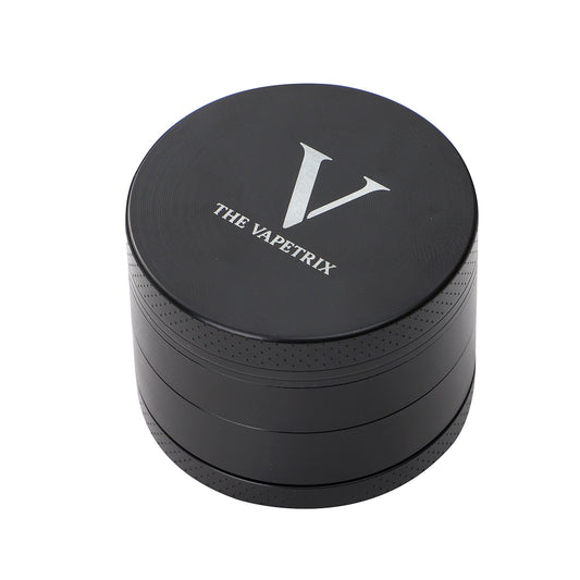 Grinder à herbes noir 4 pièces The Vapetrix à couvercle magnétique, contient 5 capsules de dosage